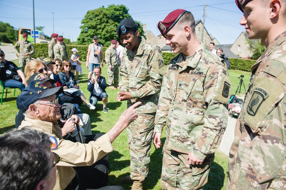 Paratrooper speaks with World War II Veteran