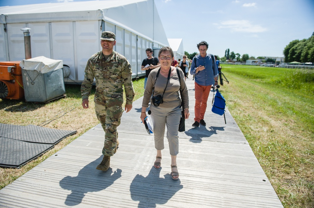 French speaking Soldier escorts media