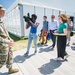 Soldier leads media through logistics area