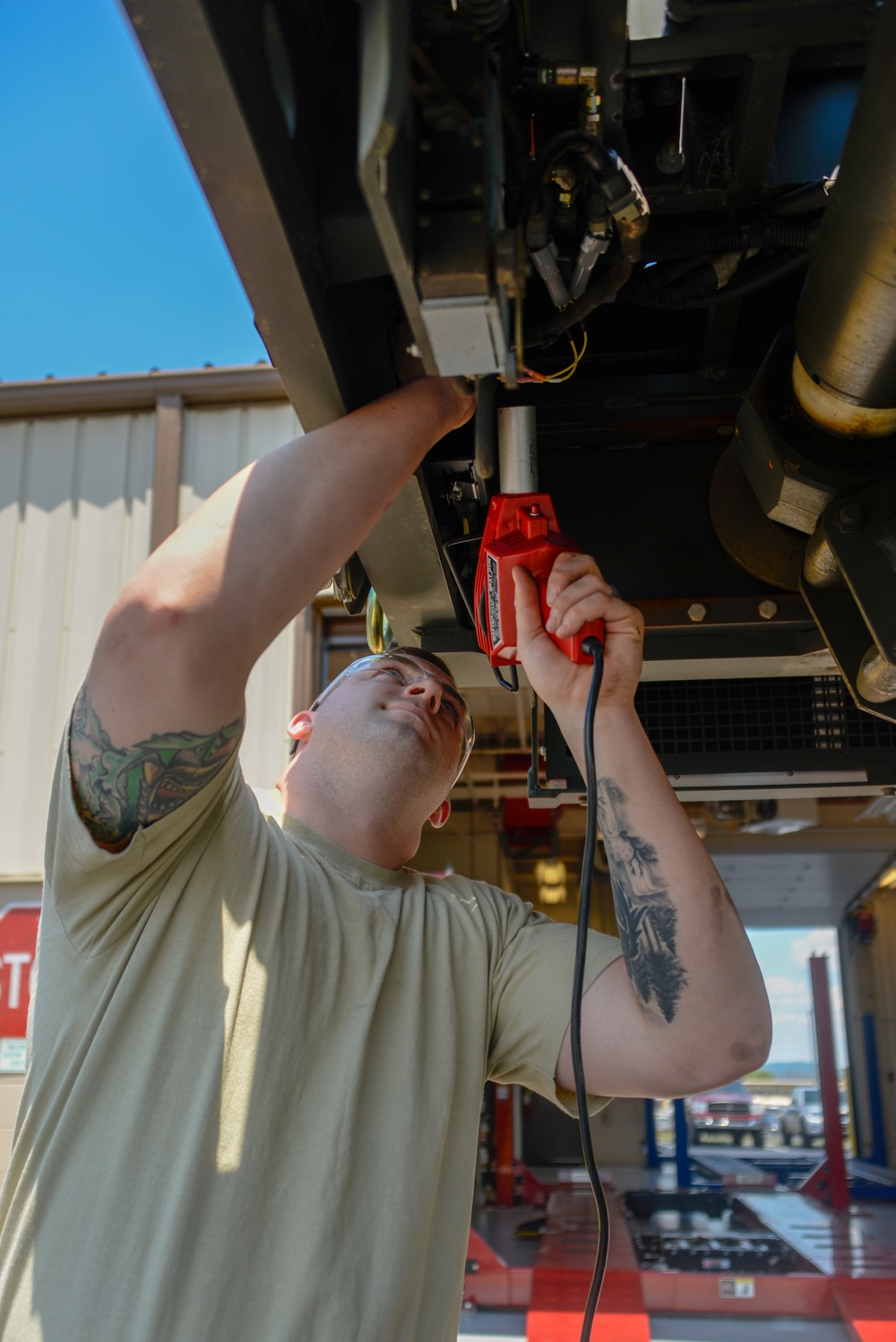 Vehicle Maintenance Airmen Work on Equipment