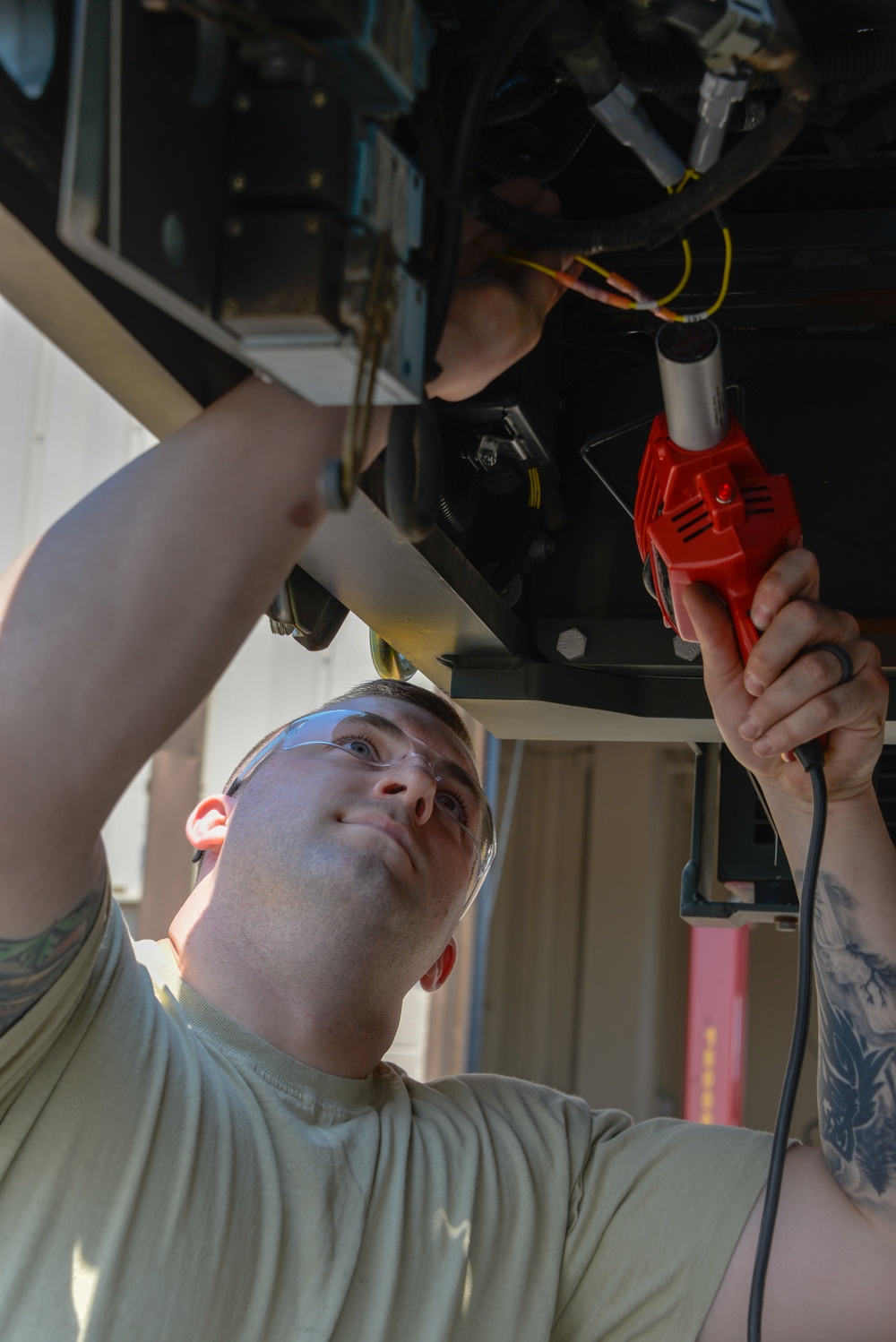 Vehicle Maintenance Airmen Work on Equipment
