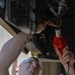 Vehicle Maintenance Airmen Work on Equipment