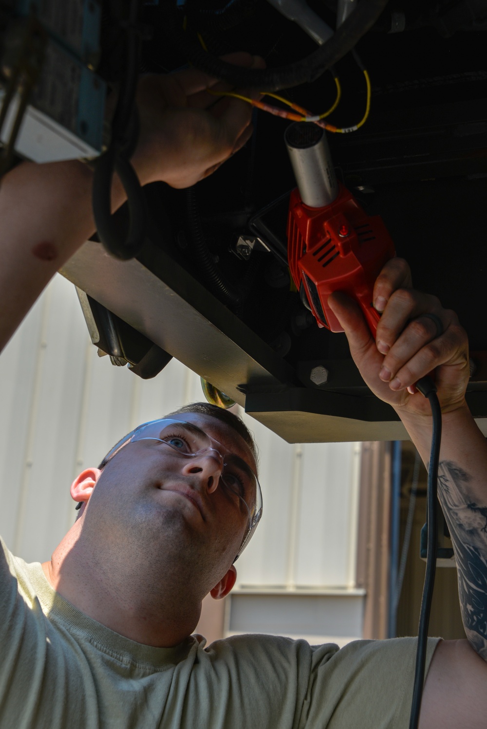 Vehicle Maintenance Airmen Work on Equipment