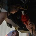 Vehicle Maintenance Airmen Work on Equipment
