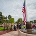 Crowd gathers for lowering of flag