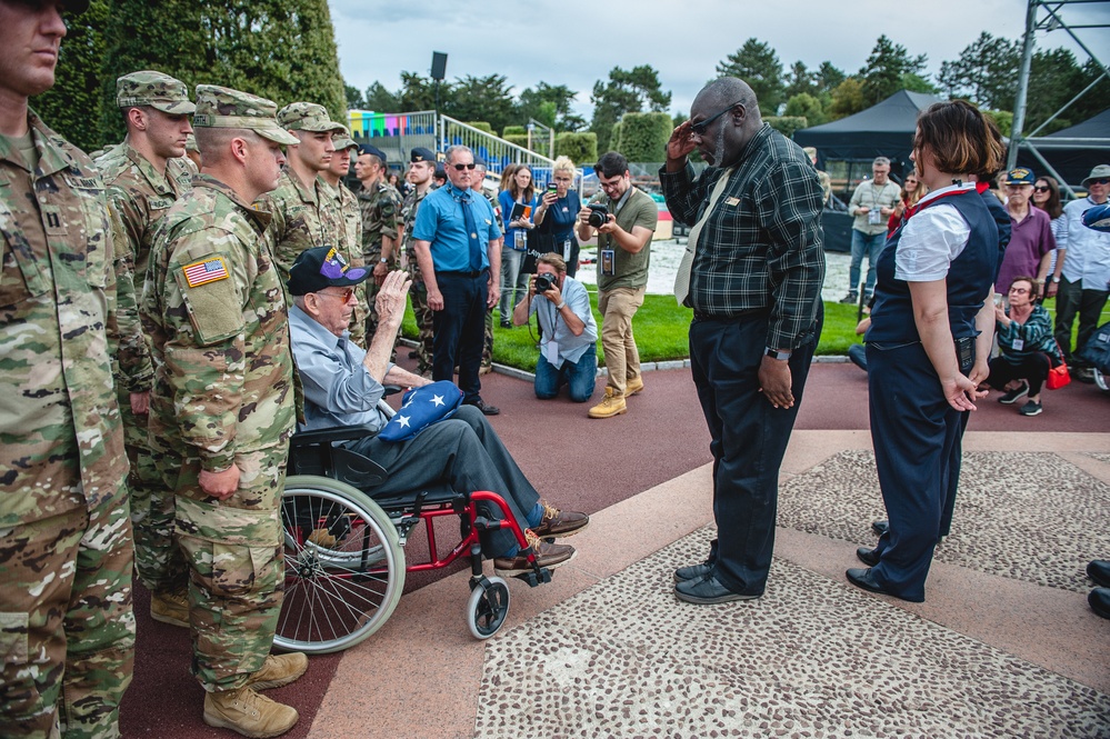 Staff Member Renders Salute at Ceremony