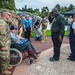 Staff Member Renders Salute at Ceremony