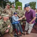 Veterans from different eras exchange greetings