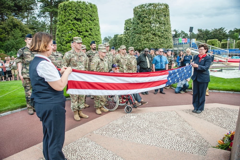 ABMC staff members fold U.S. flag