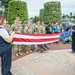 ABMC staff members fold U.S. flag