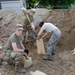 Airmen fill sand bags for flood fighting