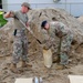 Airmen fill sand bags for flood fighting