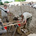 Airmen fill sand bags for flood fighting