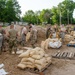 Airmen fill sand bags for flood fighting