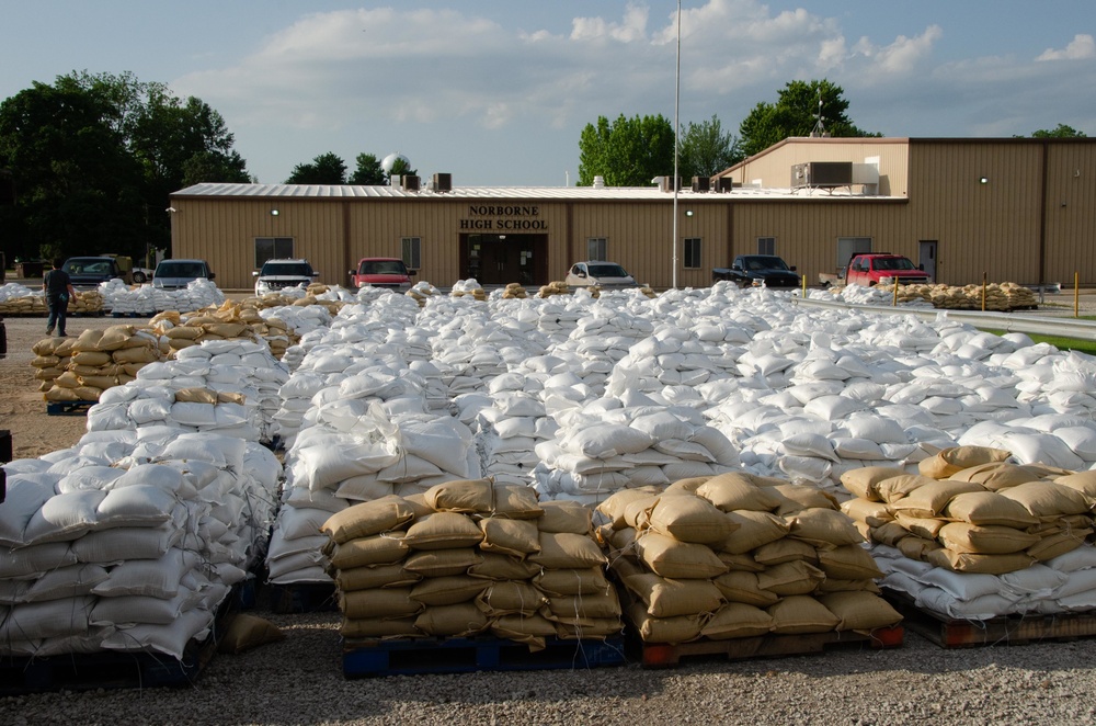 Airmen fill sand bags for flood fighting