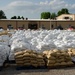 Airmen fill sand bags for flood fighting