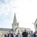 French Tour Guide Leads a Crowd