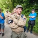 Tourist Listens Closely During Tour in Picauville