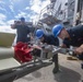 Sailors load an m54 surface vessel torpedo tube aboard the Arleigh Burke-class guided-missile destroyer USS McCampbell (DDG 85).