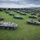 A static display of Romanian Land Force vehicles are staged in the background of the opening ceremony of Saber Guardian 2019
