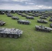 A static display of Romanian Land Force vehicles are staged in the background of the opening ceremony of Saber Guardian 2019