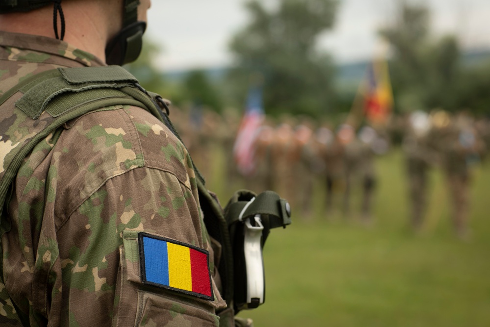 Soldiers from Romania and the U.S. stand in a combined formation during the opening ceremony of Saber Guardian 2019