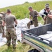 Illinois National Guard Soldiers work along the Heartwell Levee