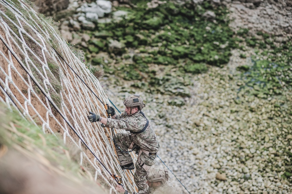 Ranger Ascends Cliff-Face