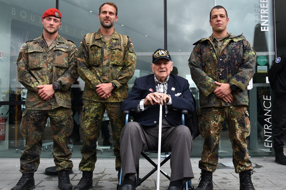 D-Day 75 WWII Veteran and German Soldiers pose for a photo