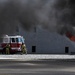 Firefighters put out car fires during Exercise Global Dragon 2019