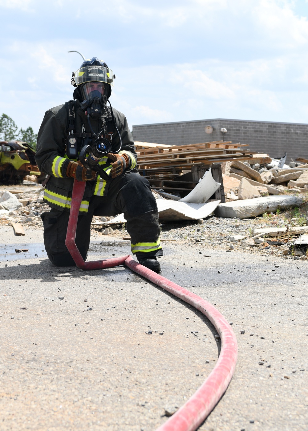 Firefighters put out car fires during Exercise Global Dragon 2019