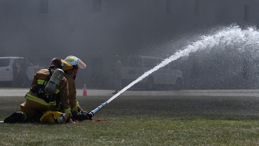 Firefighters put out car fires during Exercise Global Dragon 2019