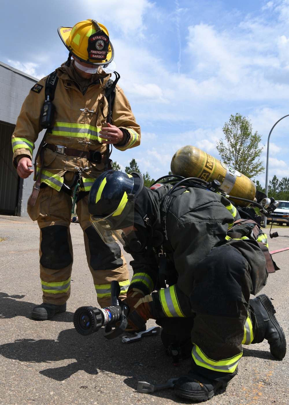 Firefighters put out car fires during Exercise Global Dragon 2019