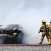 Firefighters put out car fires during Exercise Global Dragon 2019