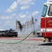 Firefighters put out car fires during Exercise Global Dragon 2019