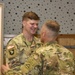 Capt. Ryan Stone receives coin at the summer exercises command.