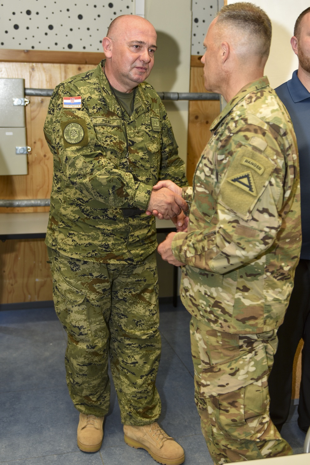 Croatian Col. Ivica Plegić receives coin at the summer exercises command.