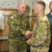 Croatian Col. Ivica Plegić receives coin at the summer exercises command.