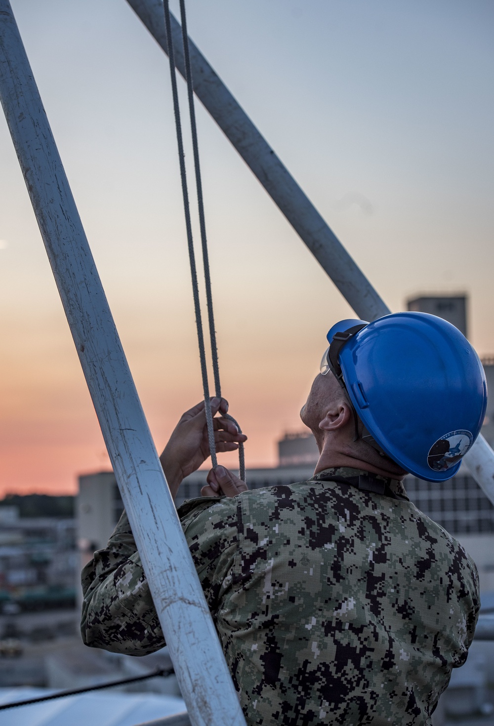 Sailor lowers First Navy Jack