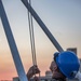 Sailor lowers First Navy Jack