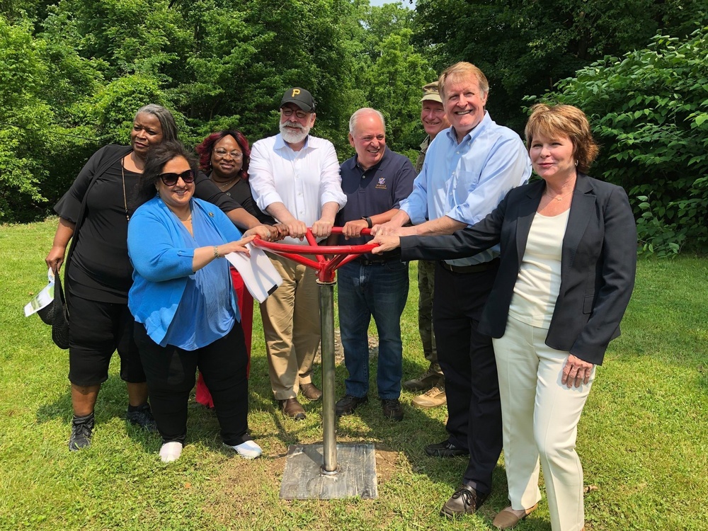 Members of ALCOSAN, the Pittsburgh City Council, and Pittsburgh District USACE turn the valve on the Sheraden Park Aquatic Ecosystem Restoration Project.