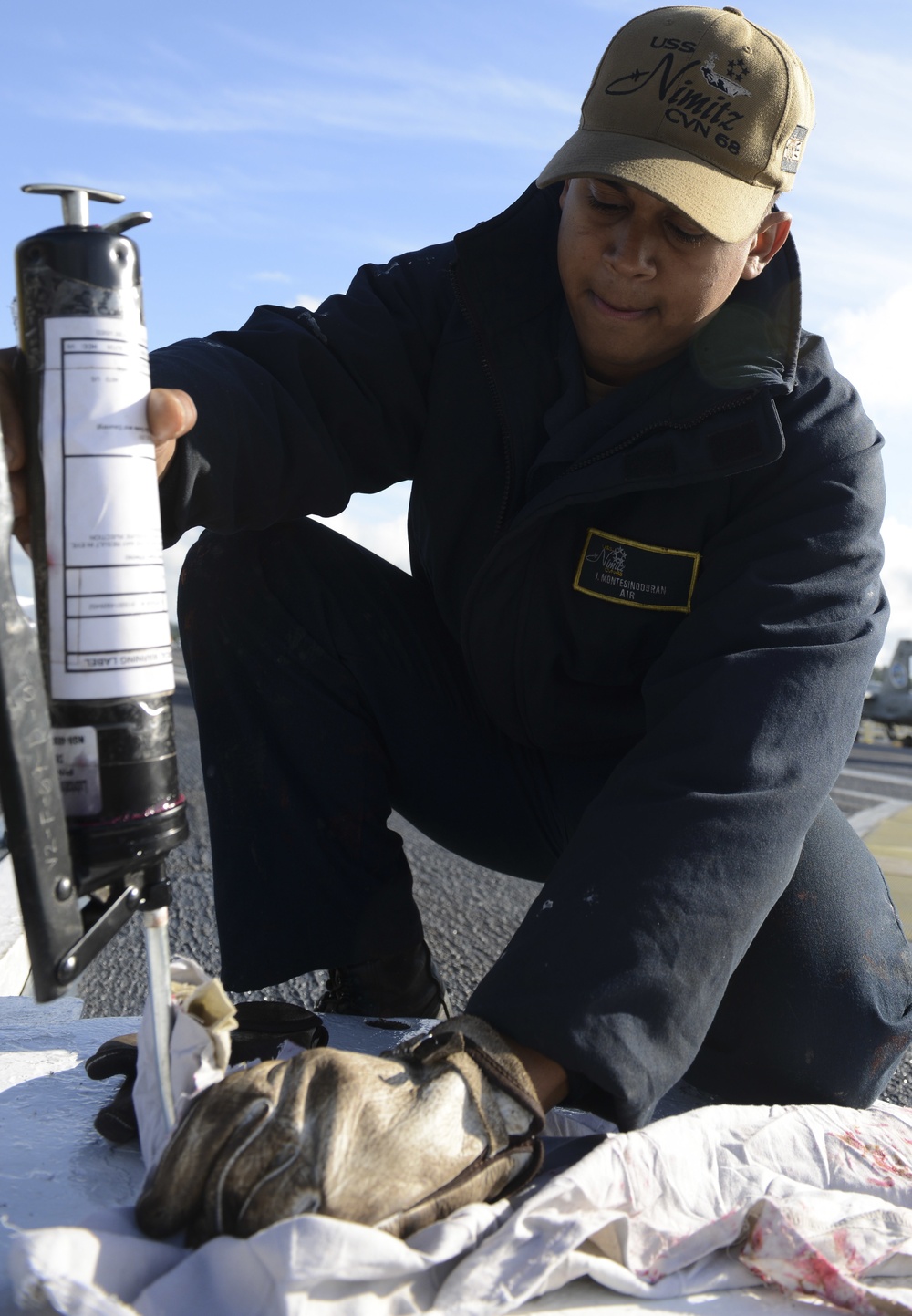 Nimitz Sailor Performs Flight Deck Maintenance