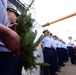 Cadets aboard the U.S. Coast Guard Tall Ship Eagle hold a wreath during a D-DAY commemoration ceremony