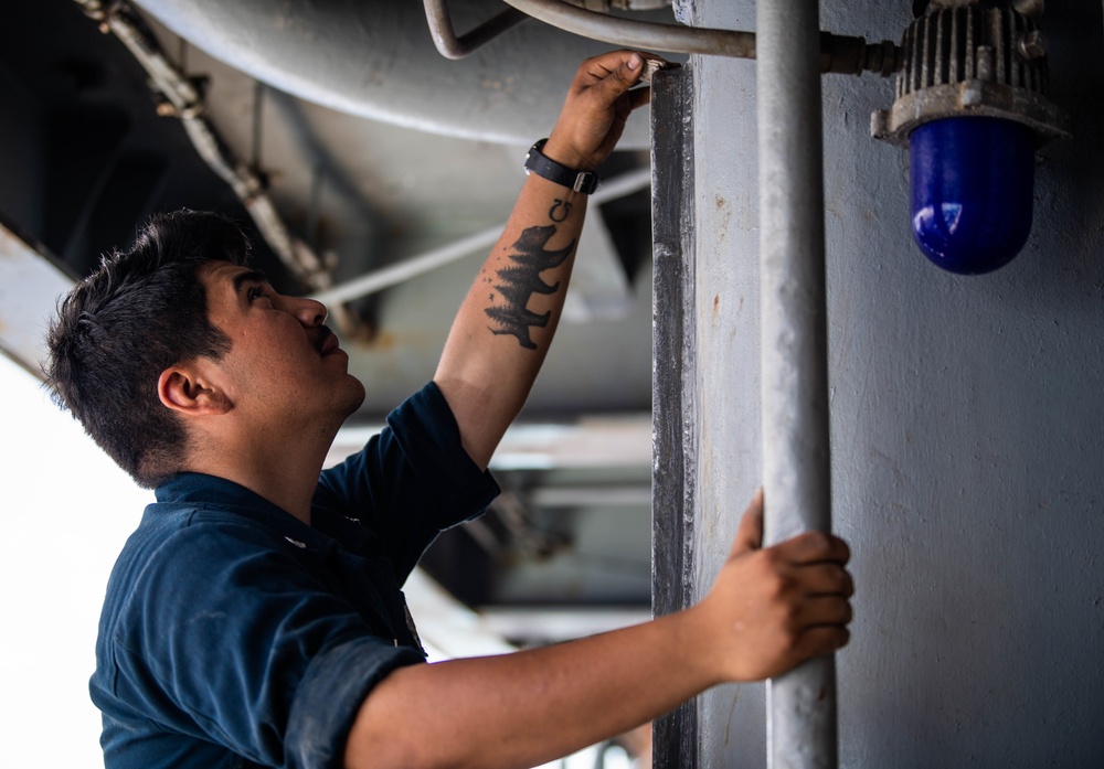 Sailors Aboard USS Harpers Ferry Perform Routine Maintenance