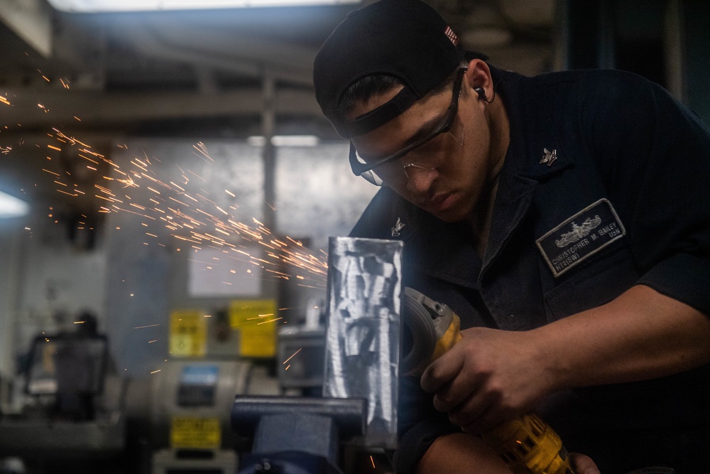 Sailors Aboard USS Harpers Ferry Perform Routine Maintenance