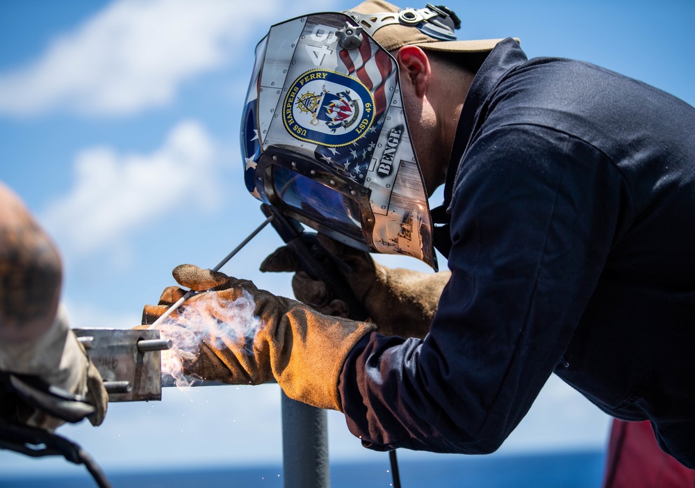 Sailors Weld Aboard USS Harpers Ferry