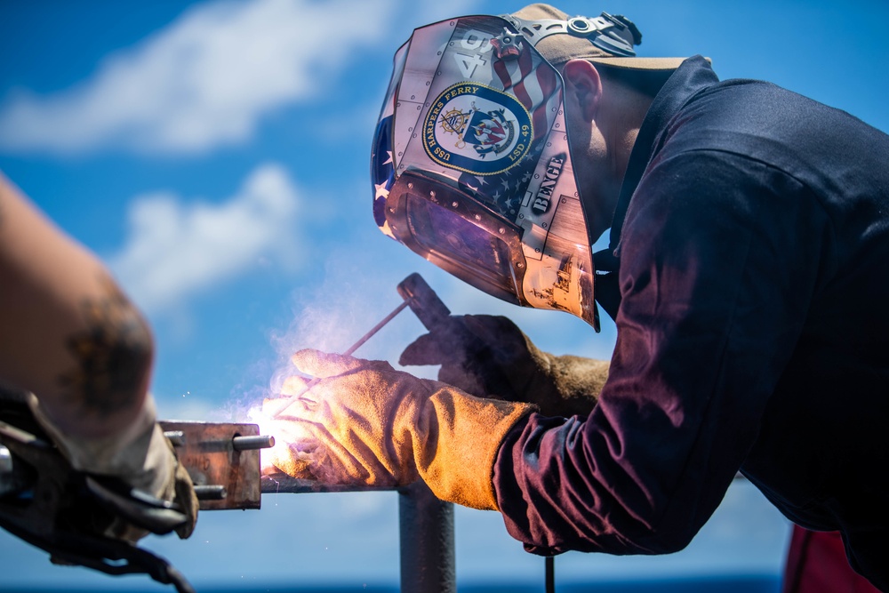 Sailors Weld Aboard USS Harpers Ferry