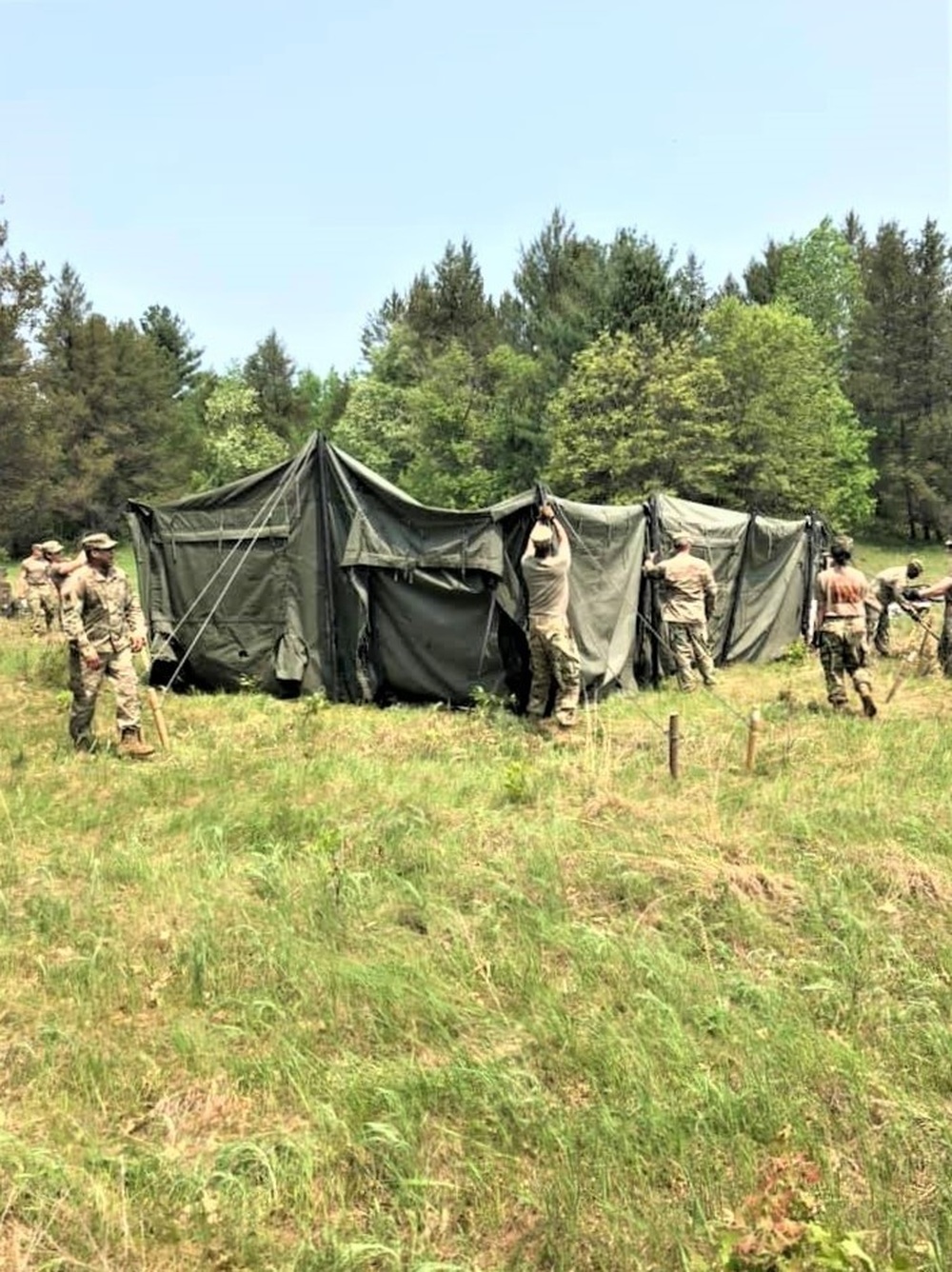 DVIDS - News - Photo Essay: 1-291 Soldiers build tents for training ops