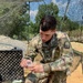 Soldier tests purified water to distribute to units participating in Strike Back 19