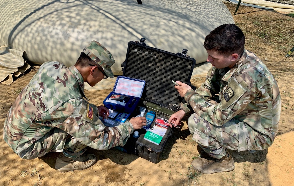 Soldiers test water before distributing to units during Strike Back 19
